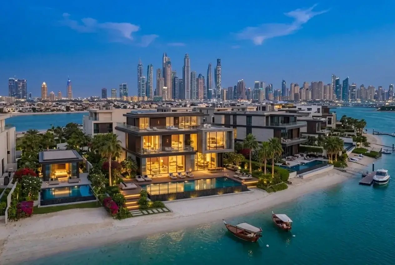Luxury waterfront villas in Dubai (The World Islands) with stunning view of Dubai Marina skyline at night